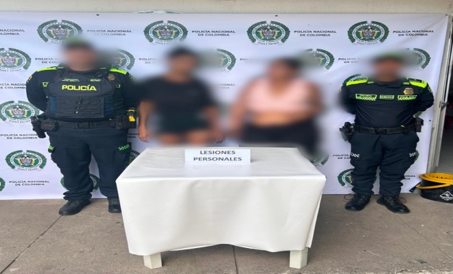 dos uniformados  con  dos ciudadana capturadas por el delito de lesiones personales 