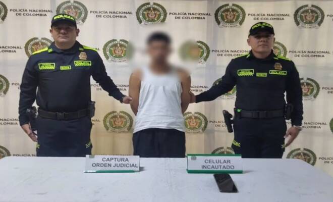 Dos policías y un capturado