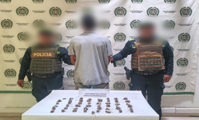 Dos funcionarios y un capturado
